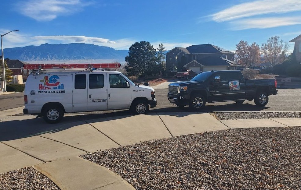 Air Dynamics of Tulsa Owner Stephen performing work on an HVAC unit in Tulsa in front of a home.